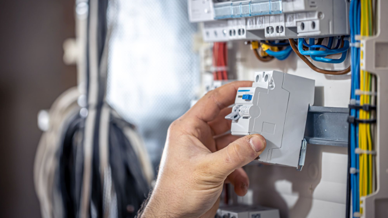 image of man installing electric fuse